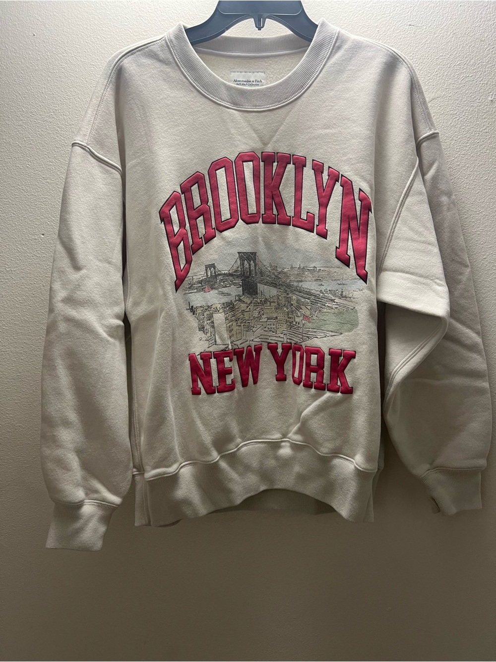 Abercrombie & Fitch Cream Crewneck Sweatshirt with Pink Lettering